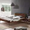 Wohnen Betten<Dunkles Holzbett aus Nussbaum Massivholz - Vetonia